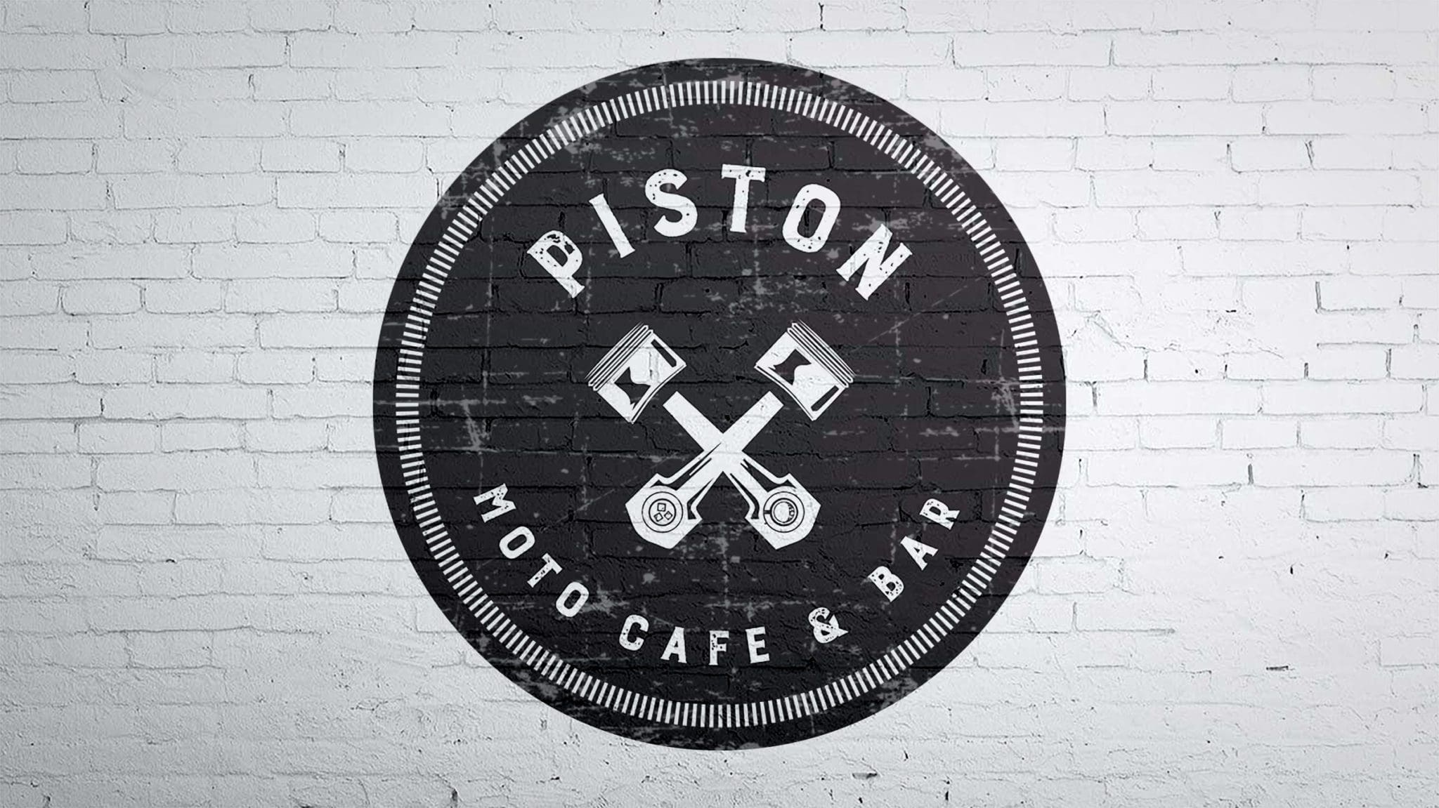 Piston Moto Cafe Painted Logo on Brick Wall